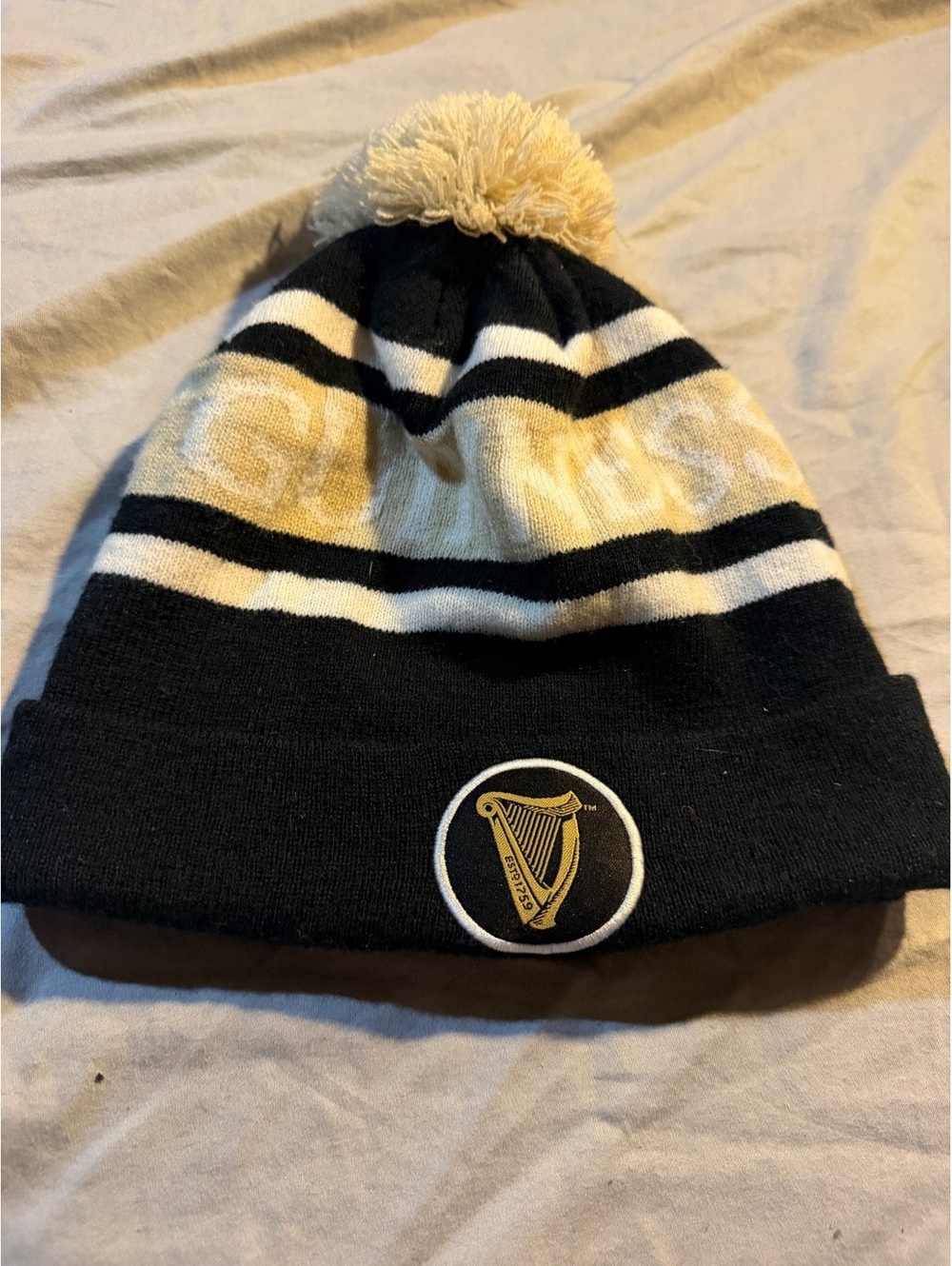 Guinness Black and White Striped Pom Pom Beanie Hat